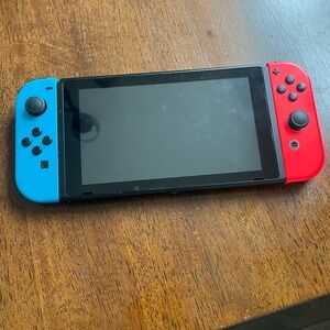 Nintendo Switch Handheld Game with Charger, hand controller and memory card